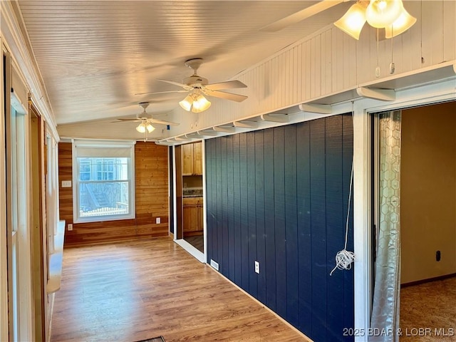 unfurnished sunroom featuring lofted ceiling