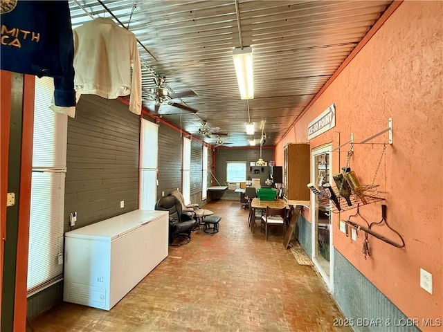21 Ke Jo Point Rd, Gravois Mills, MO 65037 - miscellaneous room with brick patterned flooring, a ceiling fan, and a textured wall