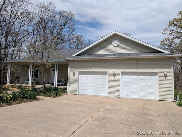 view of front of house with concrete driveway, a shingled roof, a porch, and a garage
