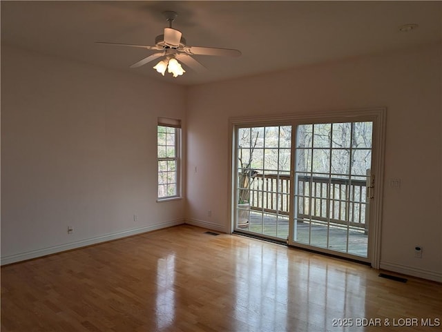 393 Crystal Springs Rd, Linn Creek, MO 65052 - spare room featuring wood finished floors and ceiling fan