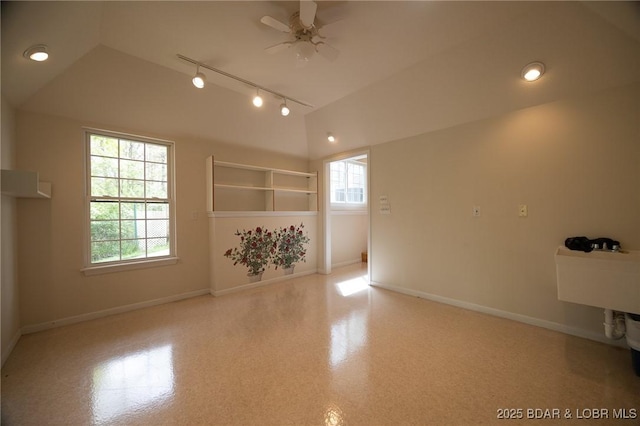 393 Crystal Springs Rd, Linn Creek, MO 65052 - empty room featuring a ceiling fan, vaulted ceiling, and track lighting