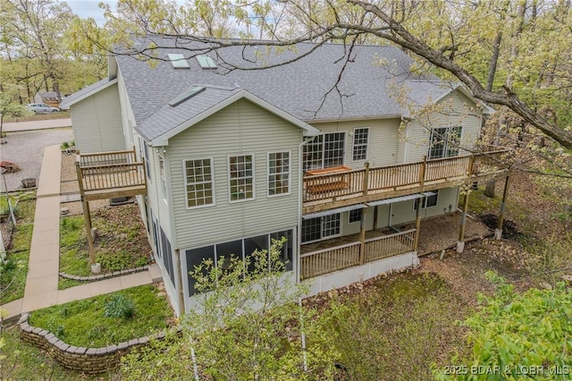 393 Crystal Springs Rd, Linn Creek, MO 65052 - back of property with a shingled roof and a wooden deck