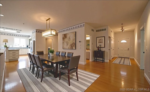 393 Crystal Springs Rd, Linn Creek, MO 65052 - dining room featuring light wood-type flooring