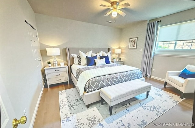 393 Crystal Springs Rd, Linn Creek, MO 65052 - bedroom featuring wood finished floors and ceiling fan