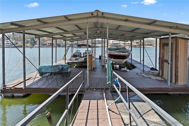 32785 Dixie Dr, Gravois Mills, MO 65037 - dock area featuring boat lift and a water view