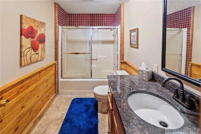 32785 Dixie Dr, Gravois Mills, MO 65037 - full bathroom featuring toilet, vanity, a textured ceiling, and enclosed tub / shower combo