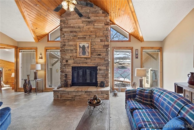 32785 Dixie Dr, Gravois Mills, MO 65037 - carpeted living area featuring vaulted ceiling, a ceiling fan, wooden ceiling, and a fireplace