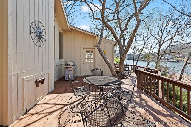 32785 Dixie Dr, Gravois Mills, MO 65037 - wooden terrace with a water view, outdoor dining area, and area for grilling