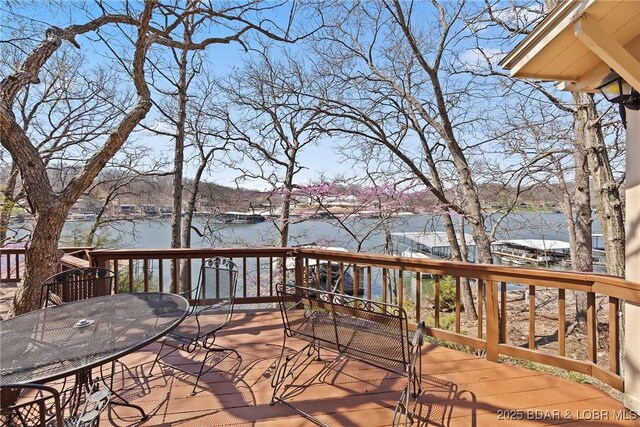 32785 Dixie Dr, Gravois Mills, MO 65037 - wooden deck with a water view and outdoor dining space