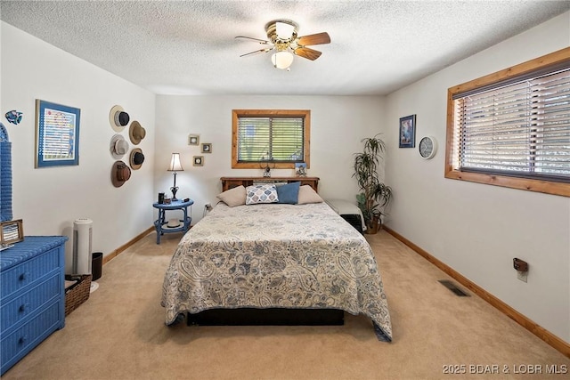 32785 Dixie Dr, Gravois Mills, MO 65037 - bedroom with light carpet, baseboards, a textured ceiling, and a ceiling fan