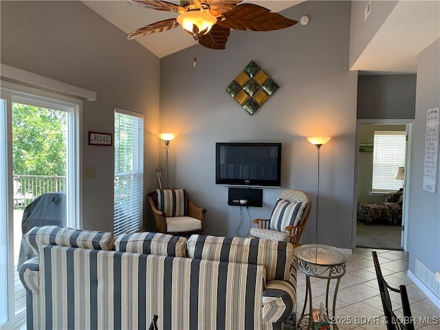 28783 Morgan Hills Rd, Gravois Mills, MO 65037 - living area featuring light tile patterned floors, a wealth of natural light, ceiling fan, and baseboards