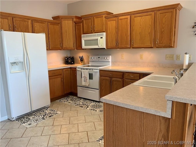 28783 Morgan Hills Rd, Gravois Mills, MO 65037 - kitchen featuring brown cabinetry, white appliances, light countertops, and a sink