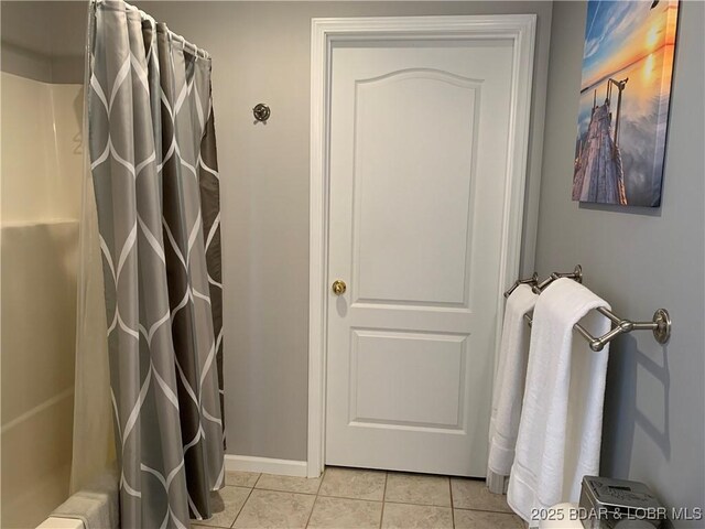 28783 Morgan Hills Rd, Gravois Mills, MO 65037 - bathroom featuring tile patterned floors, a shower with shower curtain, and baseboards