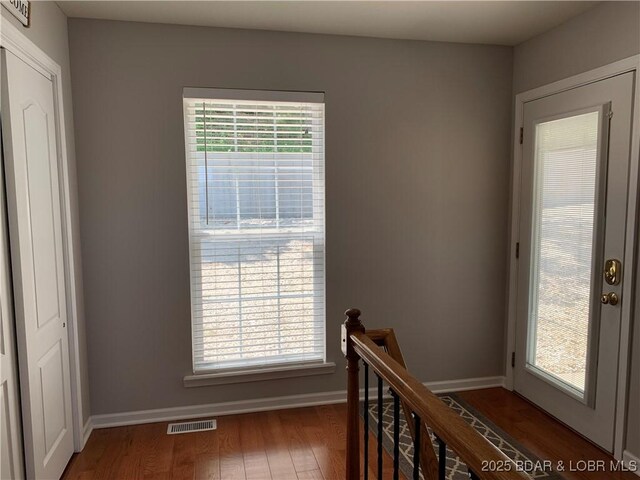 28783 Morgan Hills Rd, Gravois Mills, MO 65037 - interior space with wood finished floors, baseboards, and visible vents