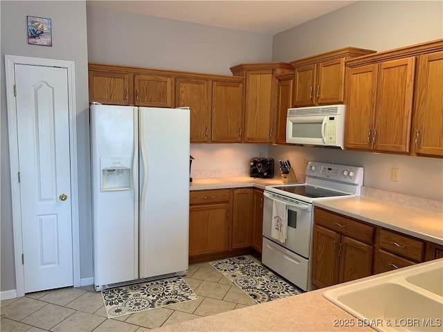 28783 Morgan Hills Rd, Gravois Mills, MO 65037 - kitchen with light countertops, white appliances, a sink, and brown cabinetry