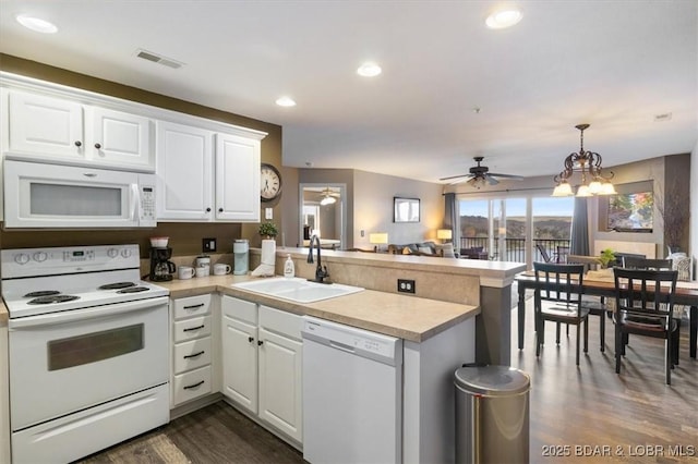 67 Cedar Heights Ln Unit 3A, Camdenton, MO 65020 - kitchen with white appliances, a sink, a peninsula, a ceiling fan, and recessed lighting