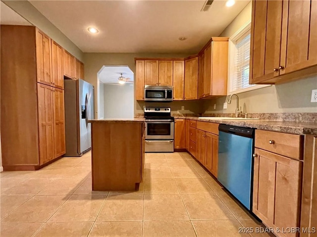 1148 Sweetwater Dr, Four Seasons, MO 65049 - kitchen featuring a center island, recessed lighting, a sink, light tile patterned floors, and stainless steel appliances