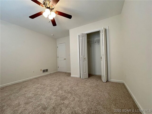 1148 Sweetwater Dr, Four Seasons, MO 65049 - unfurnished bedroom with baseboards, visible vents, light carpet, and ceiling fan