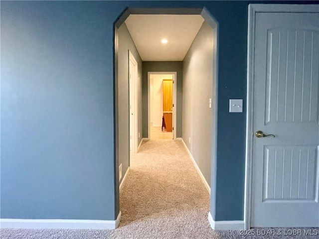1148 Sweetwater Dr, Four Seasons, MO 65049 - hall featuring baseboards, carpet flooring, and arched walkways