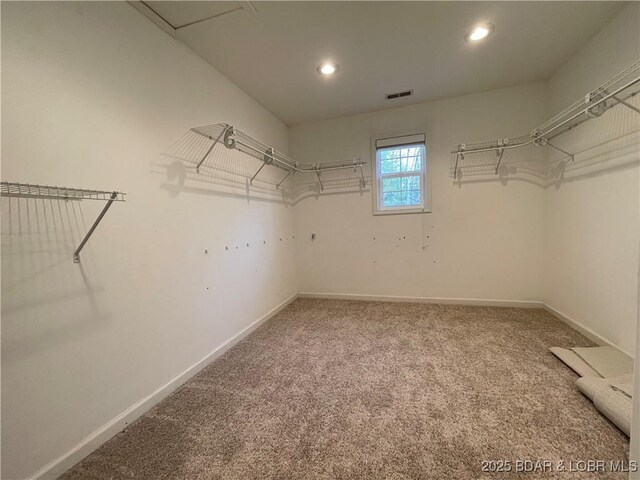 1148 Sweetwater Dr, Four Seasons, MO 65049 - spacious closet featuring visible vents and carpet