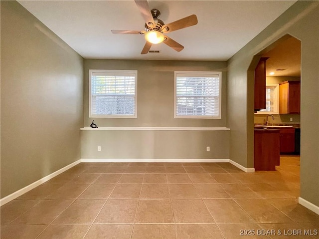 1148 Sweetwater Dr, Four Seasons, MO 65049 - spare room featuring light tile patterned flooring, ceiling fan, and plenty of natural light