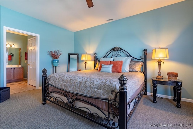 275 Flynn Rd Unit 205, Lake Ozark, MO 65049 - bedroom featuring visible vents, baseboards, ceiling fan, ensuite bath, and carpet flooring