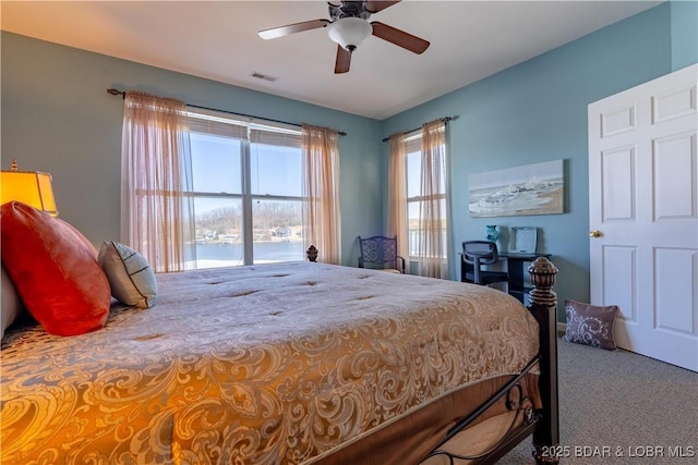 275 Flynn Rd Unit 205, Lake Ozark, MO 65049 - carpeted bedroom with a water view, visible vents, and ceiling fan