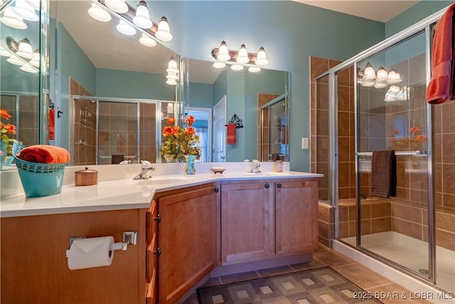 275 Flynn Rd Unit 205, Lake Ozark, MO 65049 - full bathroom featuring a tile shower, double vanity, a sink, and tile patterned flooring