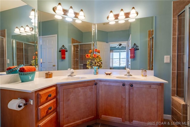 275 Flynn Rd Unit 205, Lake Ozark, MO 65049 - bathroom featuring a sink, a tile shower, double vanity, and a ceiling fan