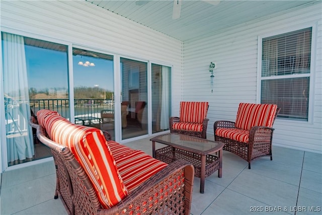 275 Flynn Rd Unit 205, Lake Ozark, MO 65049 - view of patio with a water view, ceiling fan, and an outdoor living space