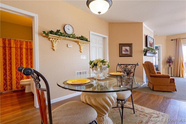 275 Flynn Rd Unit 205, Lake Ozark, MO 65049 - dining space with visible vents and wood finished floors