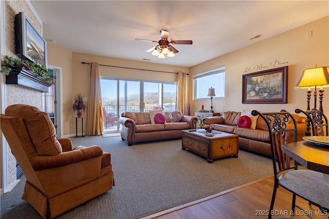 275 Flynn Rd Unit 205, Lake Ozark, MO 65049 - living area featuring visible vents, a ceiling fan, and wood finished floors