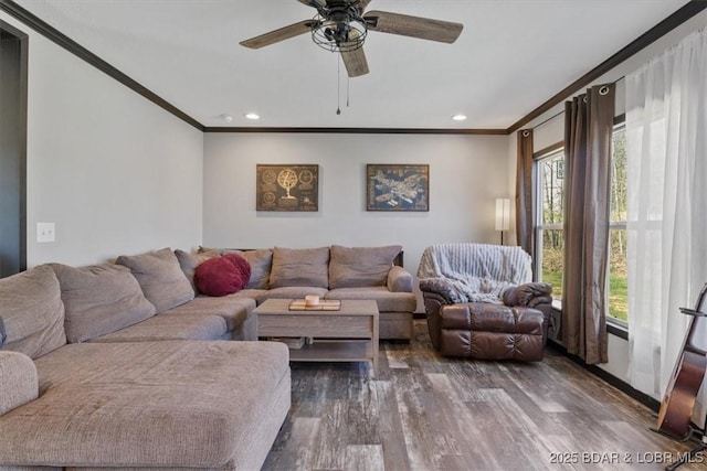 living area with ornamental molding, dark wood-type flooring, recessed lighting, and ceiling fan