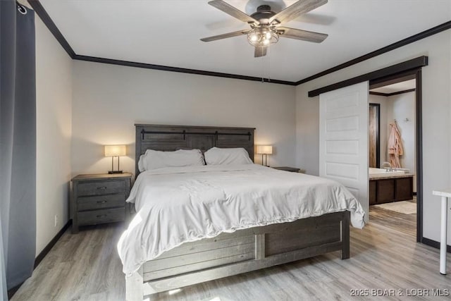 bedroom featuring ornamental molding, light wood-style flooring, baseboards, a ceiling fan, and connected bathroom