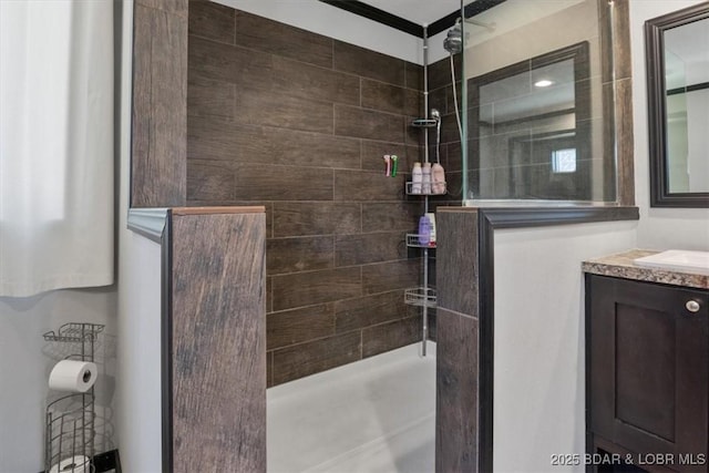 full bathroom with a walk in shower and vanity