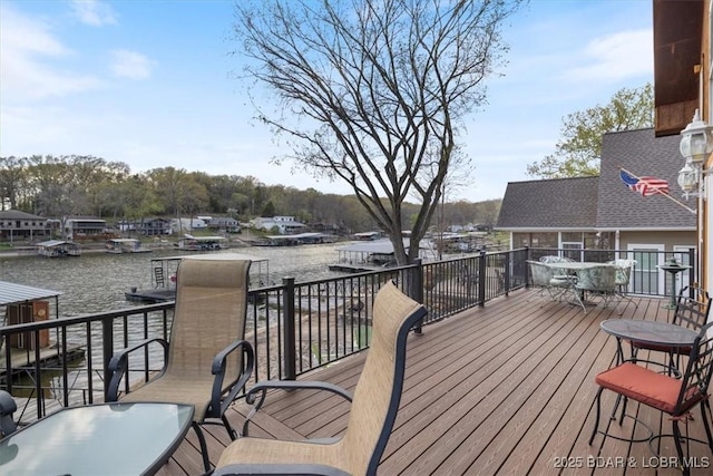 wooden deck featuring a water view