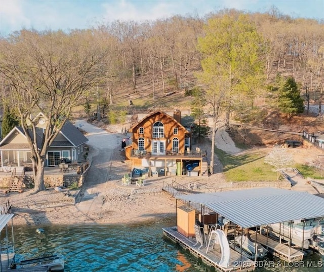 view of dock with a deck with water view