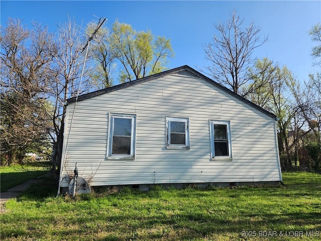 view of property exterior featuring crawl space and a lawn