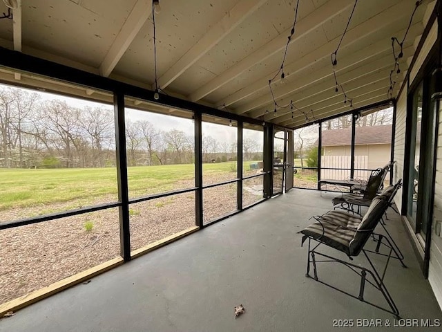 sunroom / solarium featuring a healthy amount of sunlight