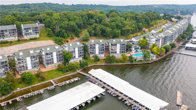 aerial view with a water view and a view of trees