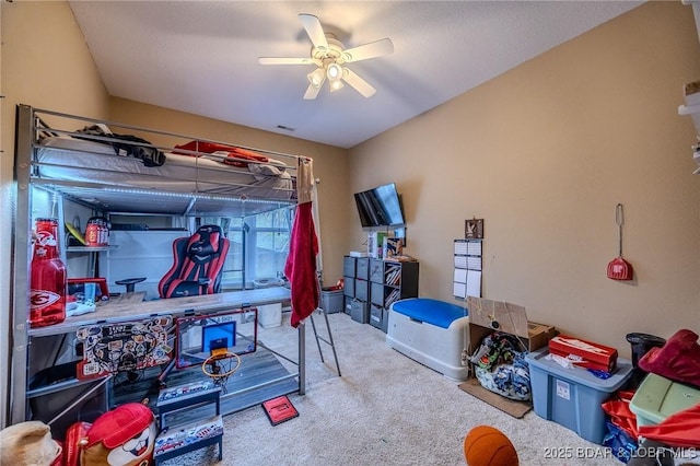 bedroom featuring carpet floors, a ceiling fan, and visible vents