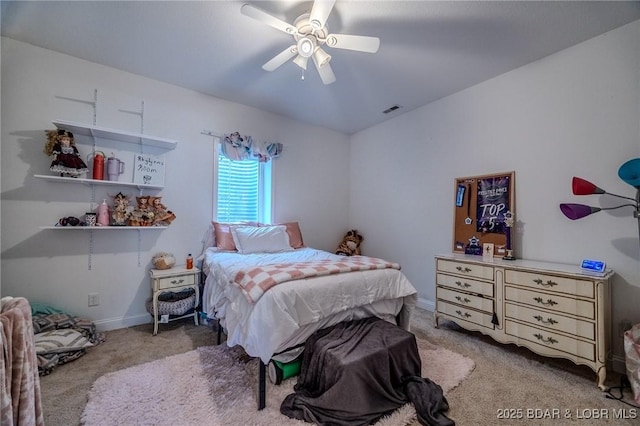 bedroom featuring visible vents, baseboards, a ceiling fan, and carpet