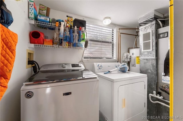 70 Ravenwood Dr, Lake Ozark, MO 65049 - washroom with washing machine and dryer and electric water heater