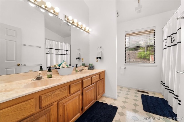 70 Ravenwood Dr, Lake Ozark, MO 65049 - bathroom with double vanity, tile patterned floors, and a shower with shower curtain