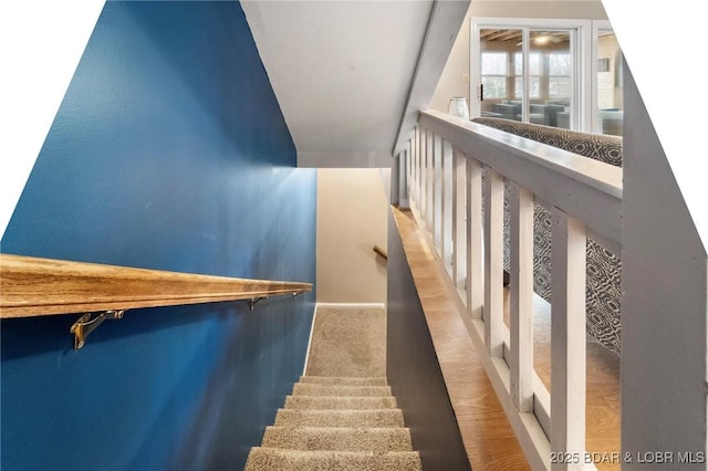 70 Ravenwood Dr, Lake Ozark, MO 65049 - stairway with vaulted ceiling and carpet