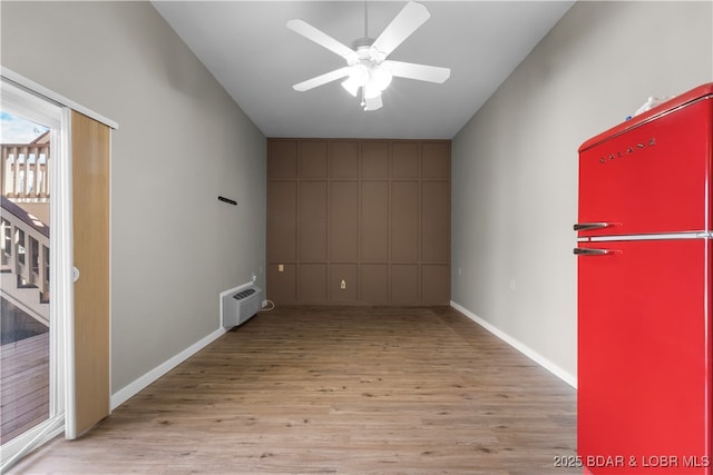 70 Ravenwood Dr, Lake Ozark, MO 65049 - empty room featuring wood finished floors, ceiling fan, and stairs