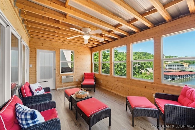 70 Ravenwood Dr, Lake Ozark, MO 65049 - sunroom with wooden walls, an AC wall unit, and wood finished floors