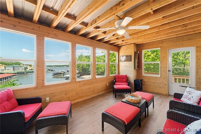 70 Ravenwood Dr, Lake Ozark, MO 65049 - sunroom featuring a water view, wooden walls, wood finished floors, and beamed ceiling