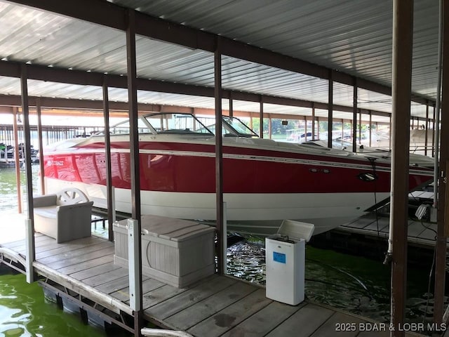 70 Ravenwood Dr, Lake Ozark, MO 65049 - dock featuring boat lift