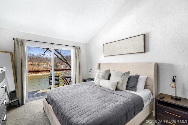 carpeted bedroom featuring lofted ceiling